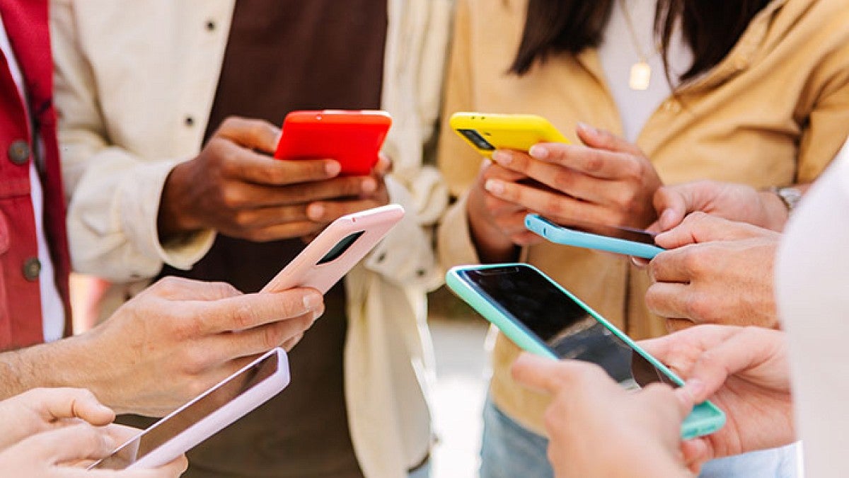 people looking at smartphones