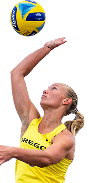 beach volleyball player spiking a ball