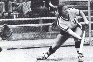 Vintage image of a woman playing softball