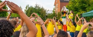 Students 'Throwing the O' in front of the Duck during IntroDUCKtion