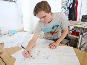 Students drawing in a sports product design class
