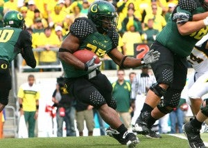Football player carrying the ball Football player carrying the ball