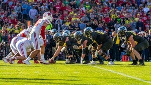Oregon lining up against Wisconsin on the line of scrimmage about to run a play