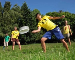 Students playing ultimate frisbee Students playing ultimate frisbee