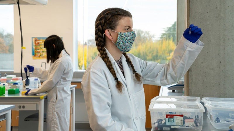 Two students working in a lab