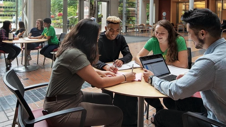 students studying around a table