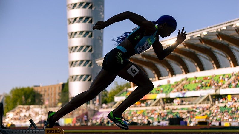 woman athlete running at hayward field