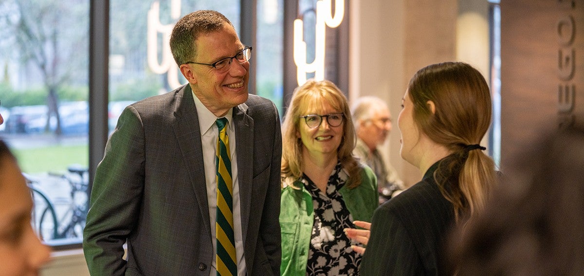 karl scholz and his wife melissa meet with a uo student