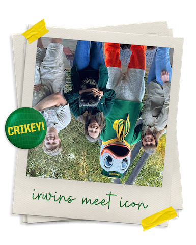 Upside down photo of the Oregon Duck posing with the Irwin family