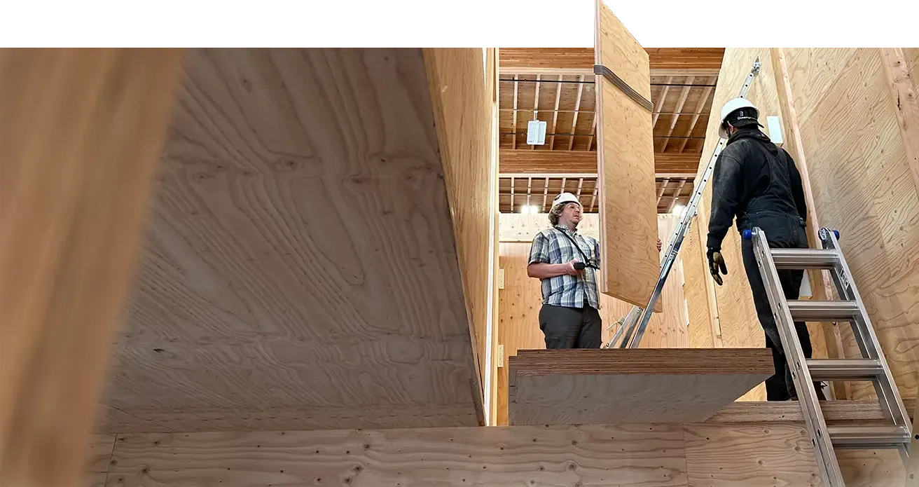 Workers constructing a house