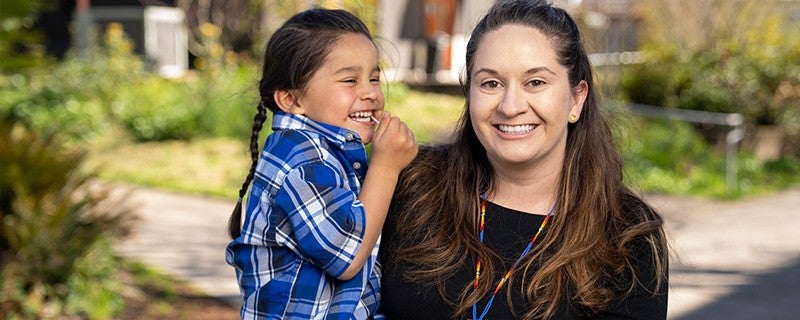 a woman holding a child