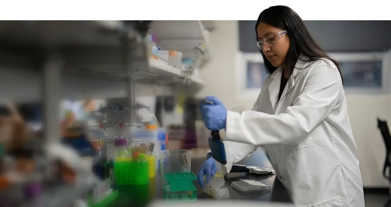Undergraduate researcher Celine Lopez Padilla working in the lab.