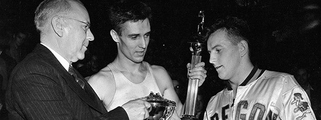 basketball player Bob Anet receiving the 1939 NCAA basketball championship trophy