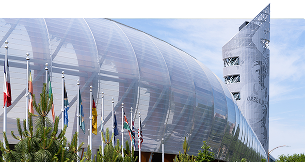 flags flying in front of Hayward Field