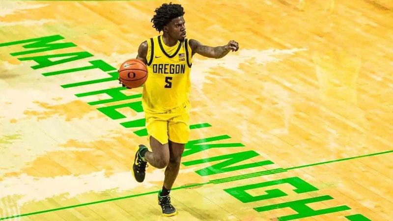 a basketball player on the court at Matthew Knight Arena