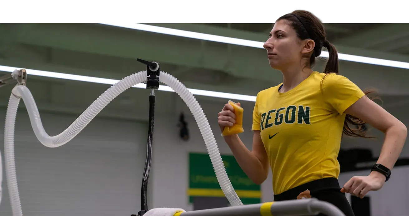an athlete runs on a treadmill in a lab