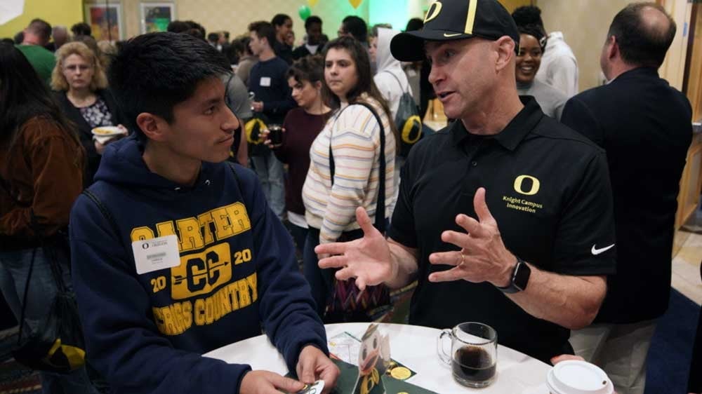 Robert Guldberg speaking with a prospective student