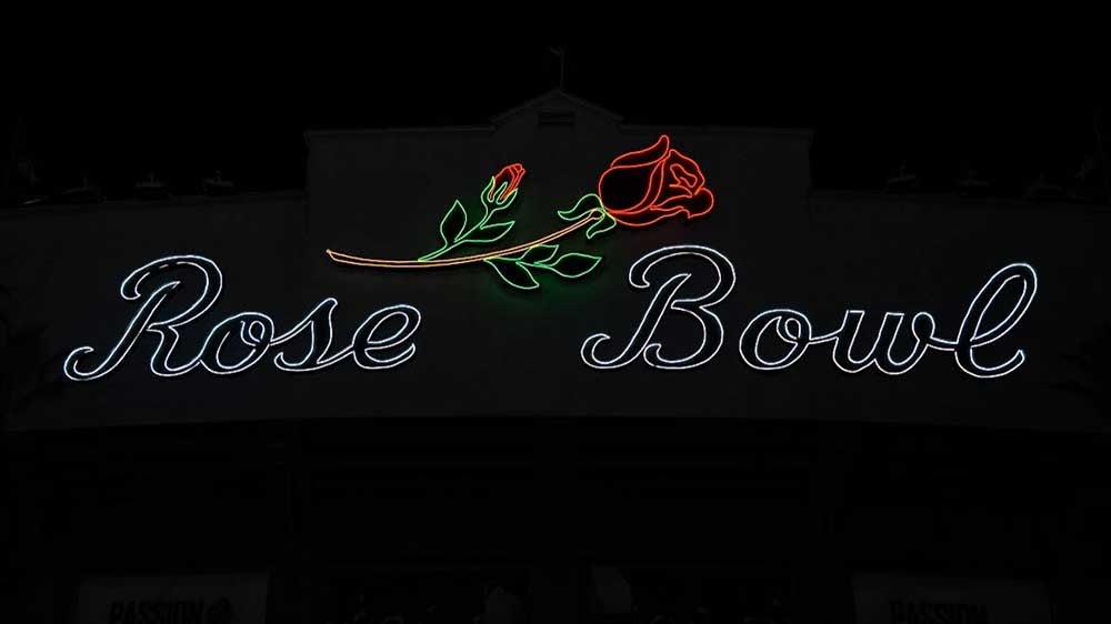 Rose Bowl sign on the outside of the stadium at night