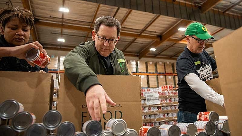 President Michael Schill helping prepare boxes at the Los Angeles Regional Food Bank