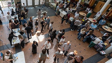 Bird's eye view of group of people at Oregon Innovation Challenge Fair