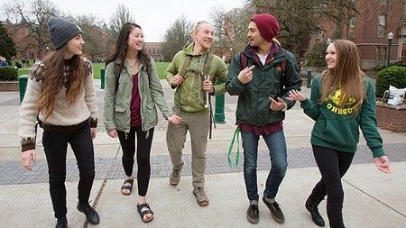 Students walking towards the Lillis Complex from the Memorial Quad