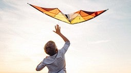 boy playing with kite