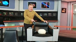 Eric Stillwell in a Star Trek costume with a Tribble