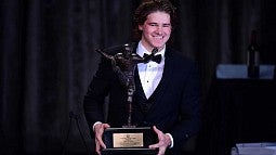 Justin Herbert with the Wiliam V. Campbell Trophy