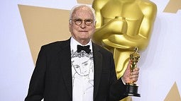 James Ivory holding his Oscar