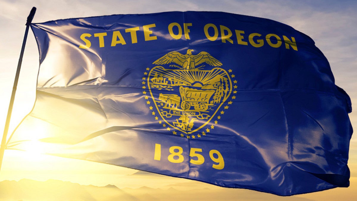 State of Oregon flag blowing in the breeze