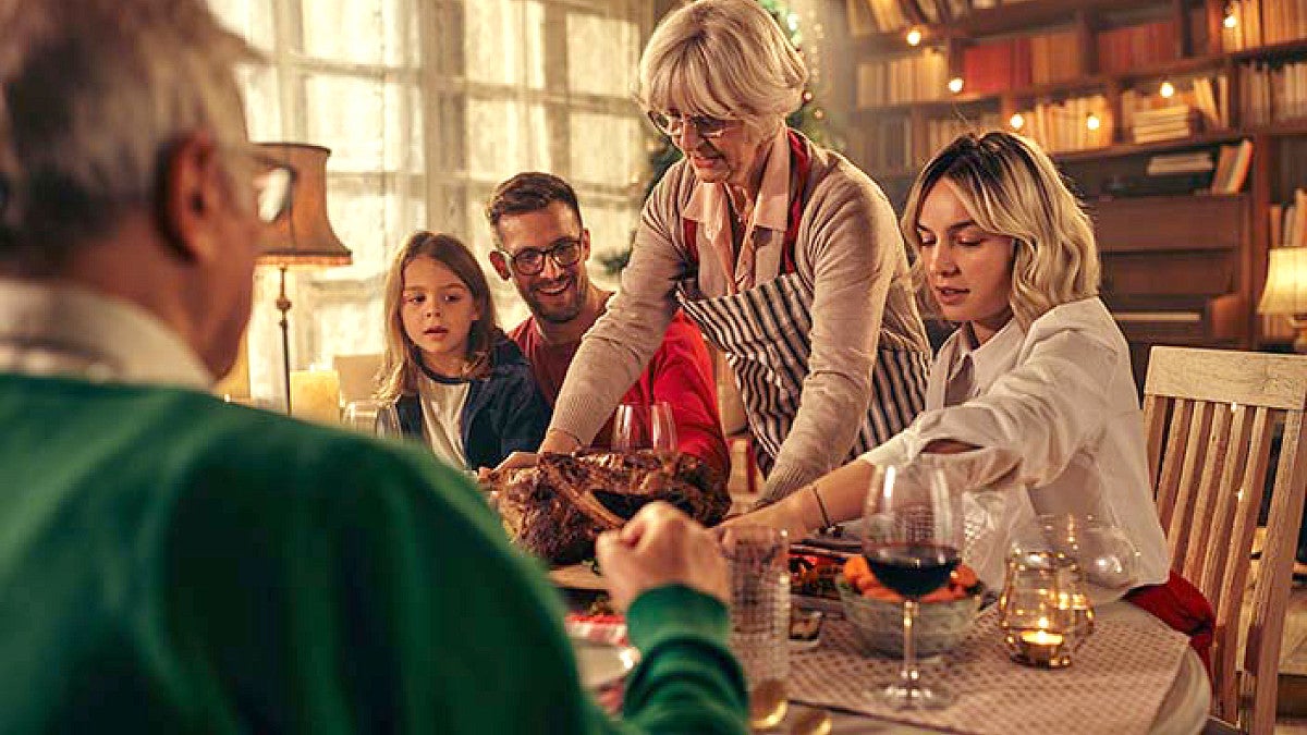 people gathered around a table for a meal