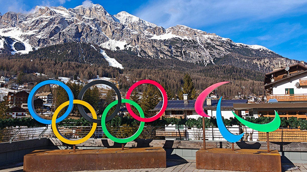 the olympic rings in front of a mountain