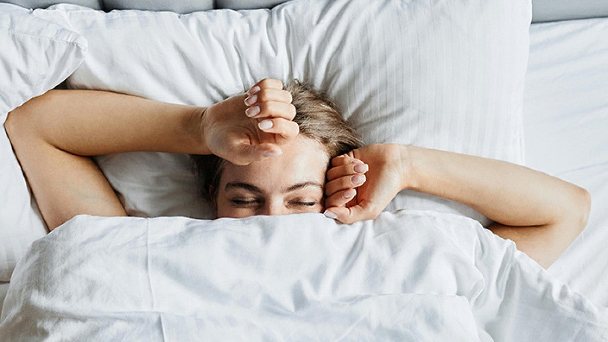 a person sleeping in a bed