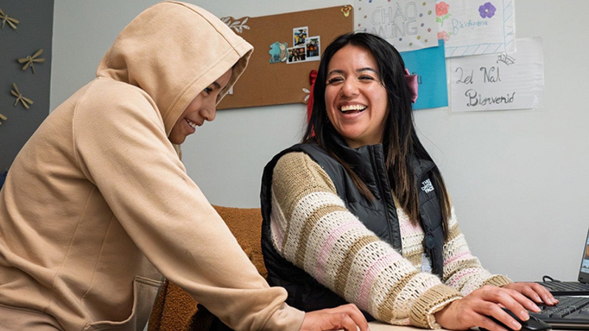 Adriana Alvarez talking with a student
