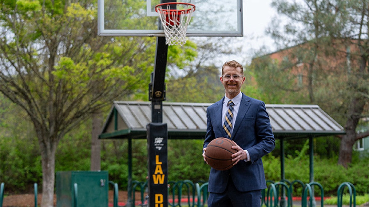 David Weber holding a basketball
