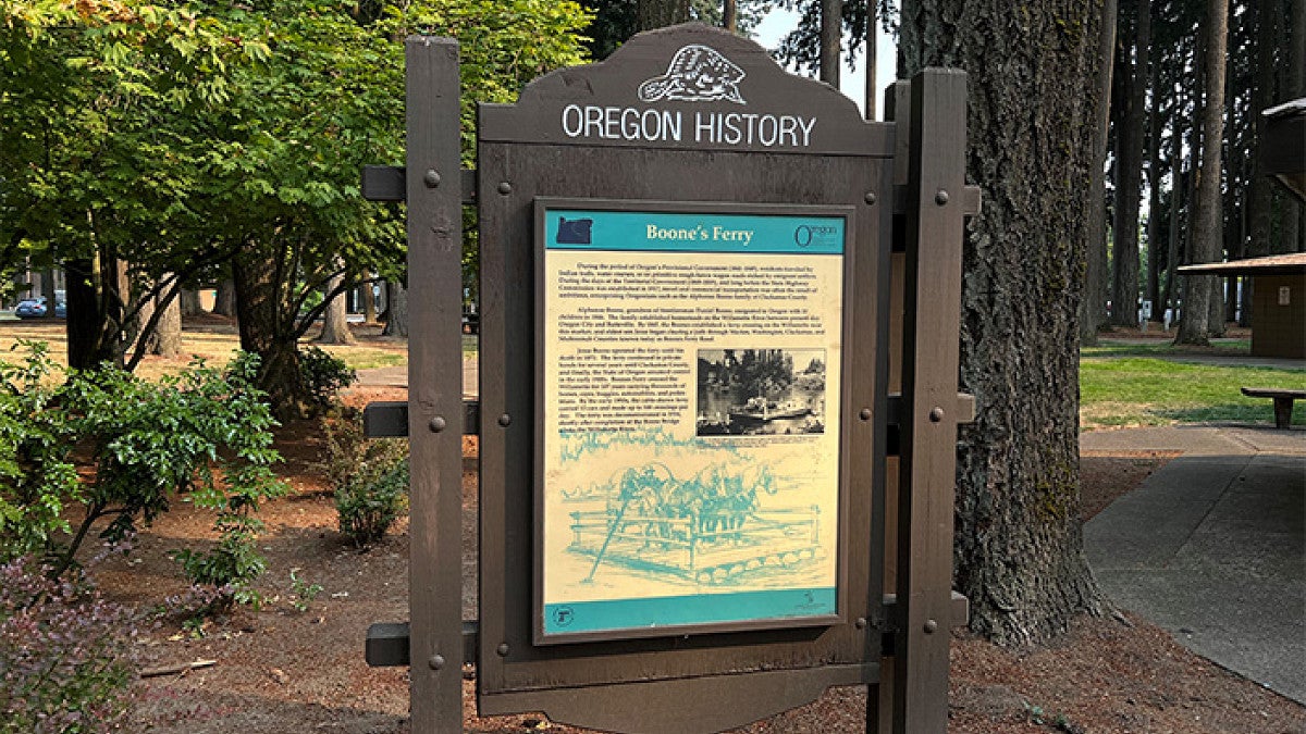 a sign describing the history of Boone's Ferry