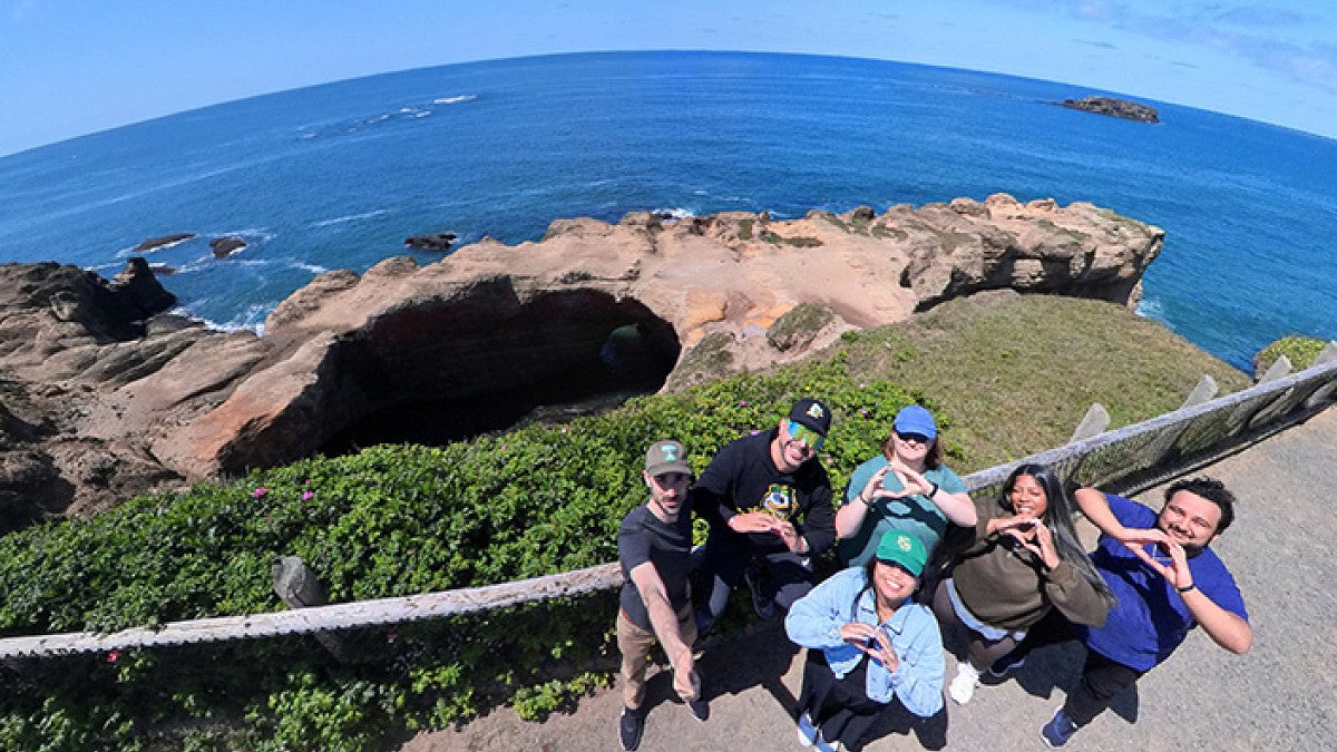 scholars gather at Devil's Punch Bowl on the Oregon coast