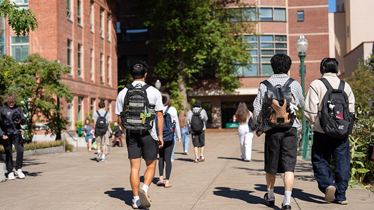 students walking on the Eugene campus