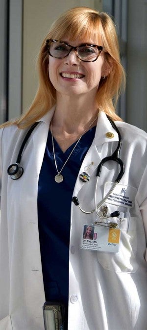 Dr. Bronwyn Baz in her white coat and stethoscope