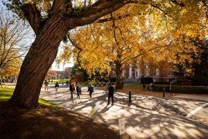 Students walking through campus near Johnson Hall during the fall