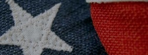 A start and red strip from a close up of the American flag