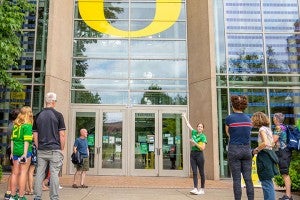 Campus tour group in front of the Lillis Business Complex