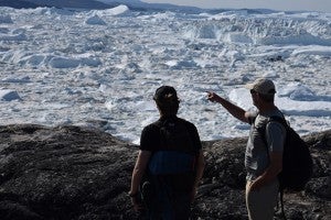 students in front of a glacier