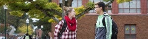 Two students talking to each other on campus Two students talking to each other on campus