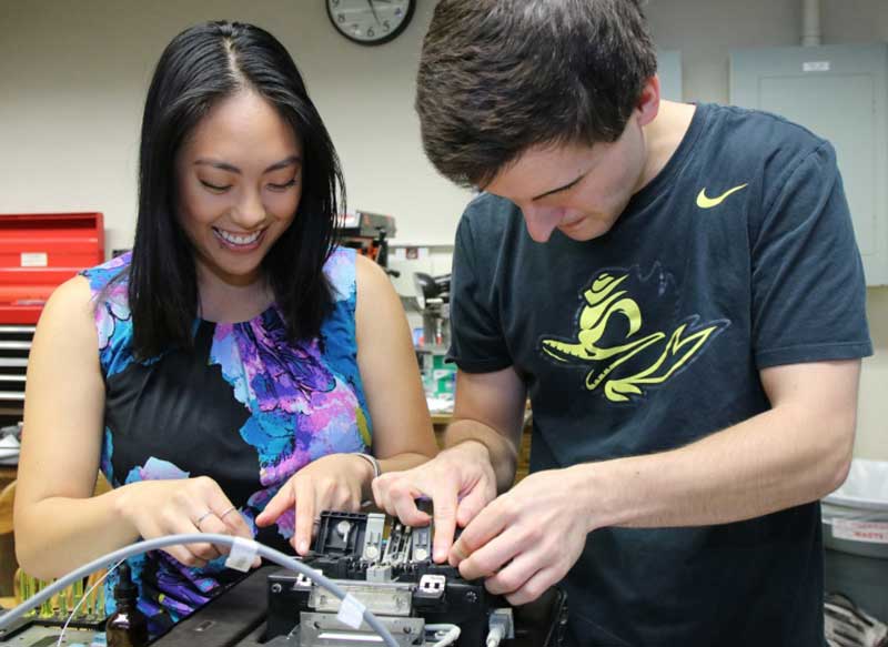 Kimberly Belmes and Kyle Klosterman, students in the Master's Industrial Internship Program, work on a project.
